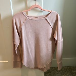 This is a light pink long sleeve from dry goods in a size small